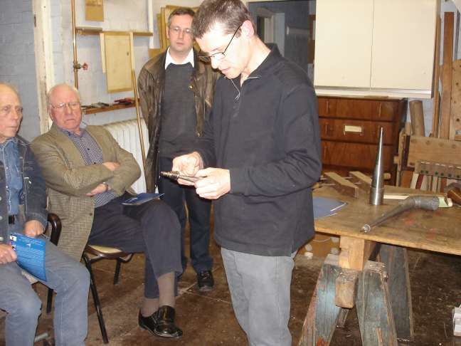 Terry Shires demonstrates making a reed pipe